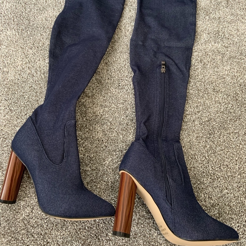 Brand new in the box over the knee boots.
